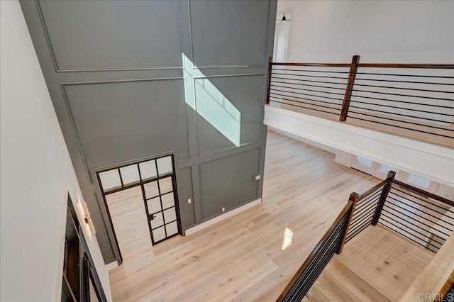 staircase with wood-type flooring