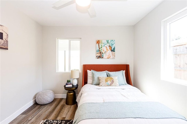 bedroom with hardwood / wood-style floors and ceiling fan