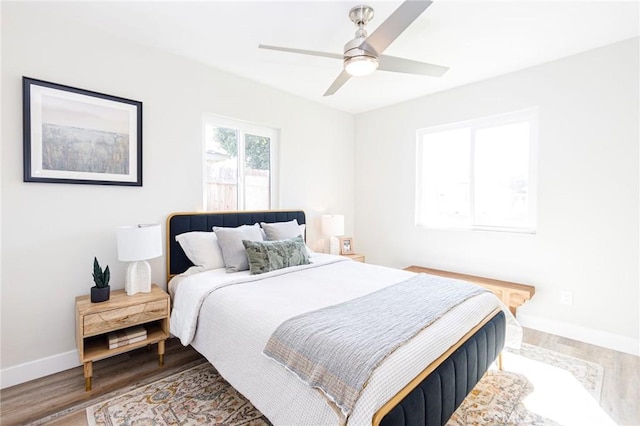 bedroom featuring hardwood / wood-style flooring and ceiling fan