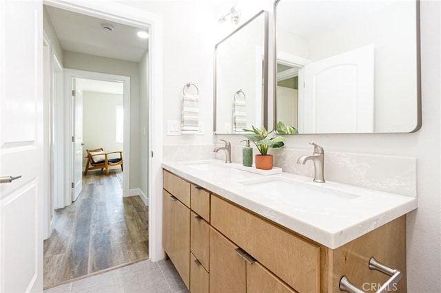 bathroom with hardwood / wood-style floors and vanity