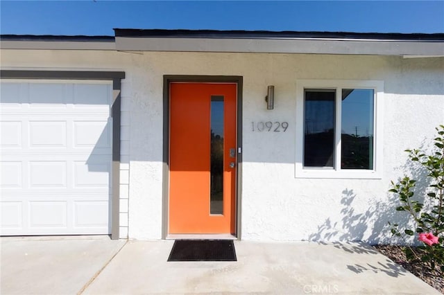 property entrance with a garage