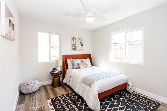 bedroom with ceiling fan and hardwood / wood-style floors