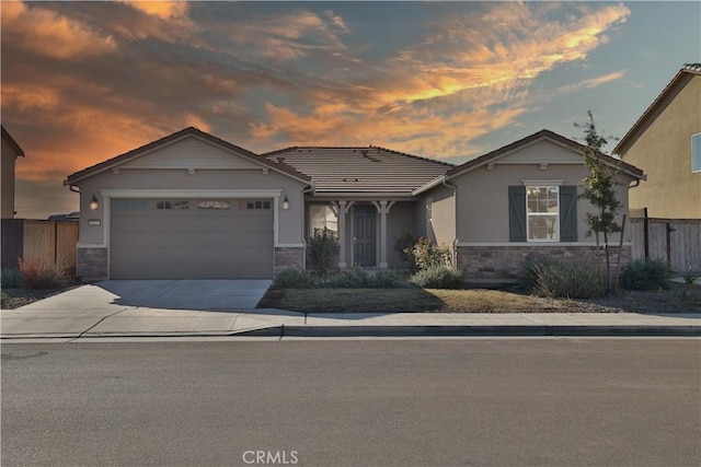 view of front of property with a garage