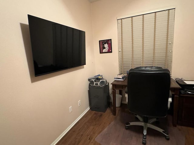 office space with wood-type flooring