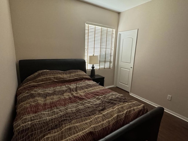 bedroom featuring dark hardwood / wood-style floors