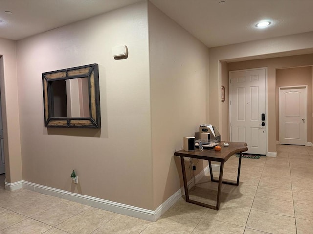 corridor featuring light tile patterned floors