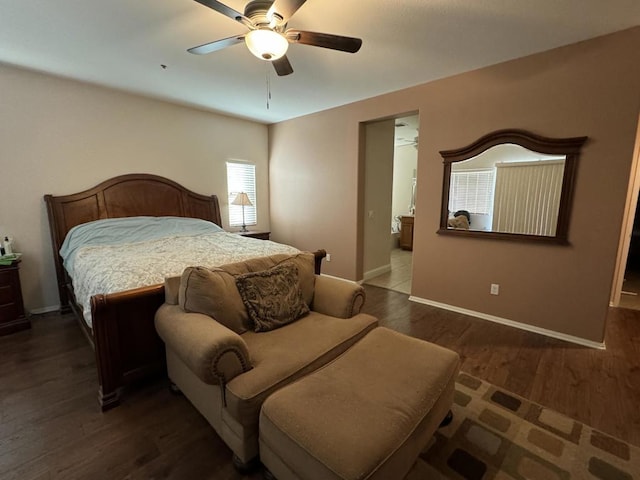 bedroom with ceiling fan and dark hardwood / wood-style floors