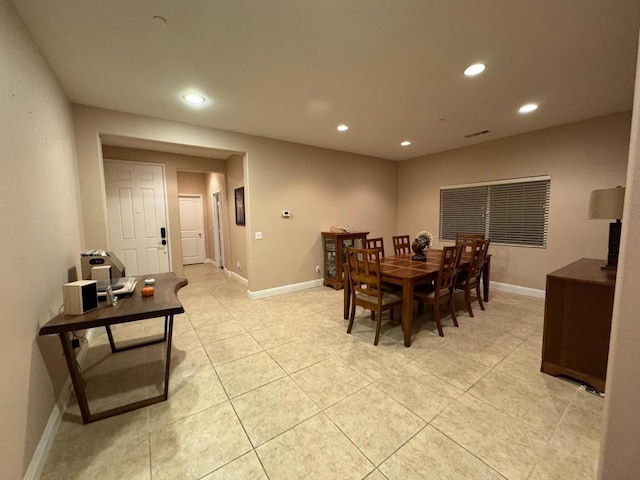 dining area with light tile patterned flooring