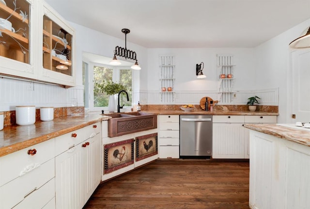 kitchen with decorative light fixtures, sink, white cabinets, dark hardwood / wood-style flooring, and stainless steel dishwasher