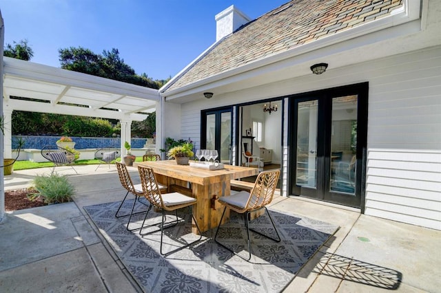 view of patio / terrace featuring a pergola and french doors