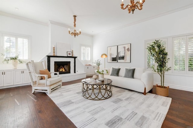 living room featuring ornamental molding, a chandelier, and hardwood / wood-style floors