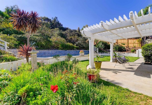 view of patio / terrace with a pool and a pergola