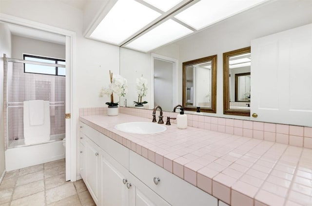 bathroom featuring vanity and washtub / shower combination