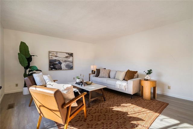 living room with dark hardwood / wood-style flooring