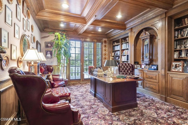 office space featuring coffered ceiling, built in shelves, crown molding, wooden ceiling, and beamed ceiling