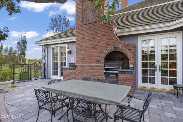 view of patio / terrace with area for grilling and french doors