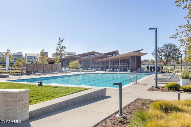 view of swimming pool featuring a patio