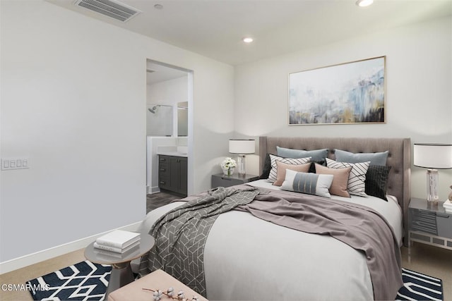 bedroom featuring carpet and ensuite bath