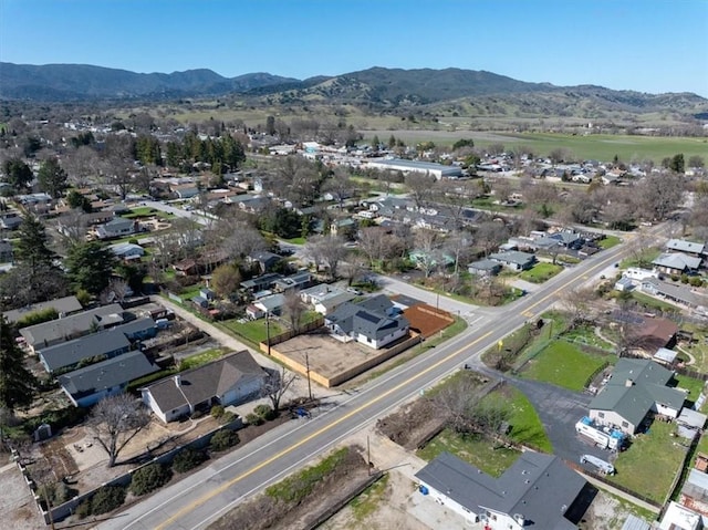 drone / aerial view featuring a mountain view and a residential view