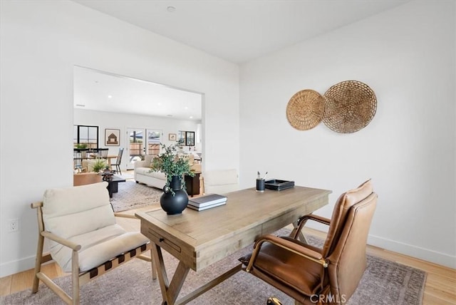 office area featuring recessed lighting, baseboards, and light wood-style floors