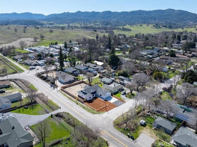 drone / aerial view featuring a mountain view and a residential view