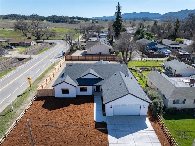 birds eye view of property featuring a mountain view and a residential view