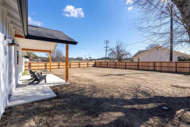 view of yard with a fenced backyard and a patio area