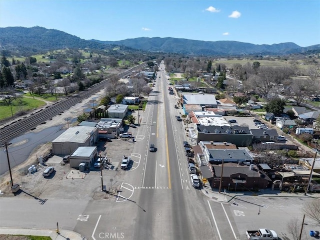 birds eye view of property featuring a mountain view