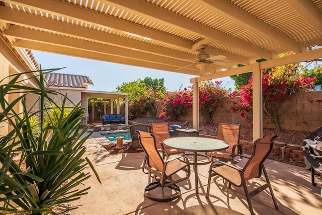 view of patio featuring ceiling fan