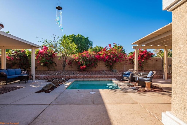 view of swimming pool with outdoor lounge area and a patio