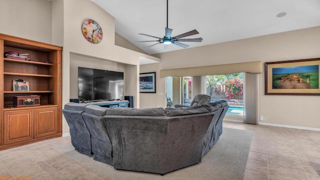 tiled living room featuring ceiling fan and high vaulted ceiling