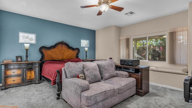 bedroom with ceiling fan and light carpet