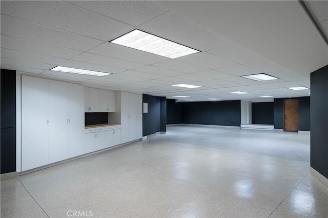 basement featuring a drop ceiling