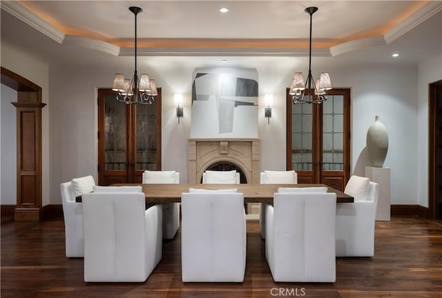 dining area with crown molding, dark hardwood / wood-style flooring, french doors, and a notable chandelier