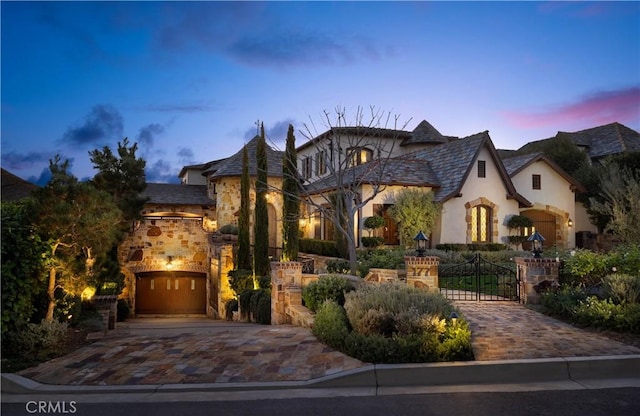 french country home with a garage