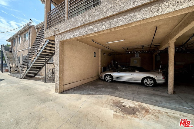 garage featuring a carport