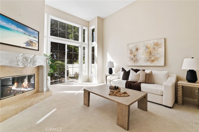 carpeted living room with a fireplace