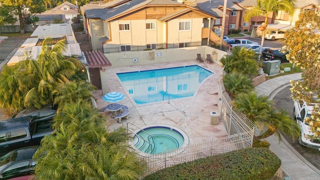 view of swimming pool with a patio