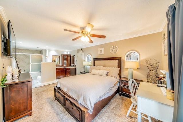 carpeted bedroom featuring ceiling fan, crown molding, and ensuite bathroom