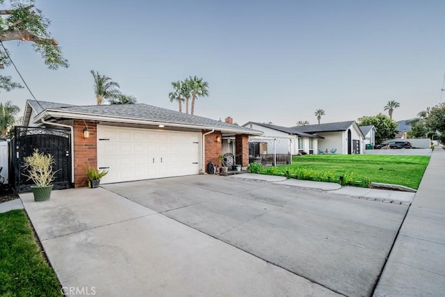 single story home with a front yard and a garage