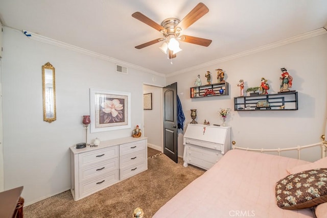 carpeted bedroom with ceiling fan and ornamental molding