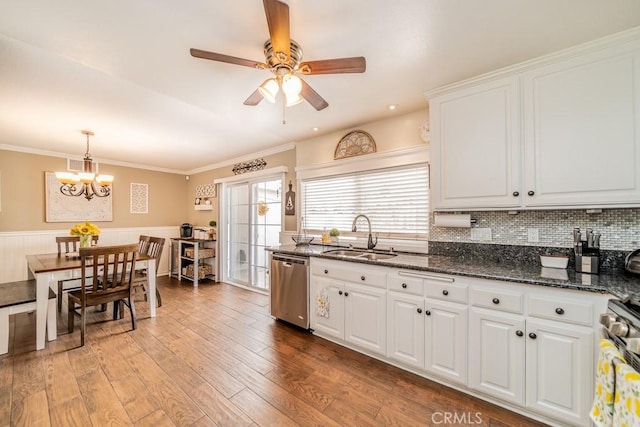 kitchen with appliances with stainless steel finishes, ornamental molding, sink, light hardwood / wood-style flooring, and white cabinets