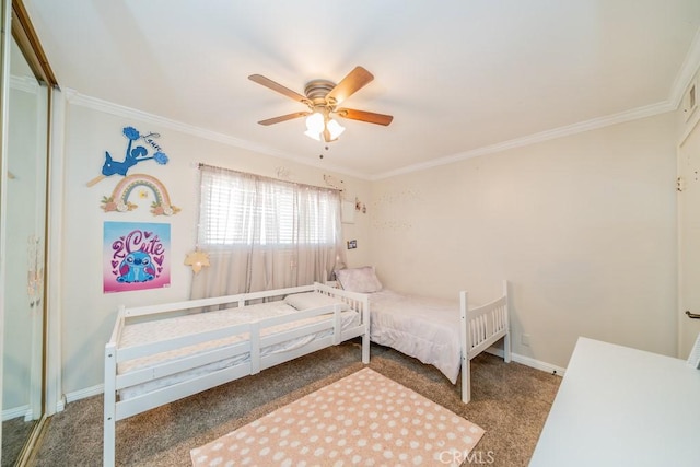 carpeted bedroom with ceiling fan and crown molding