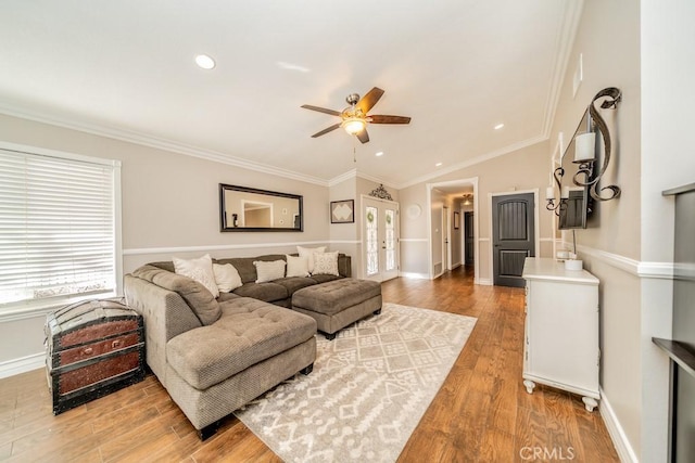 living room featuring ceiling fan, french doors, crown molding, wood-type flooring, and lofted ceiling