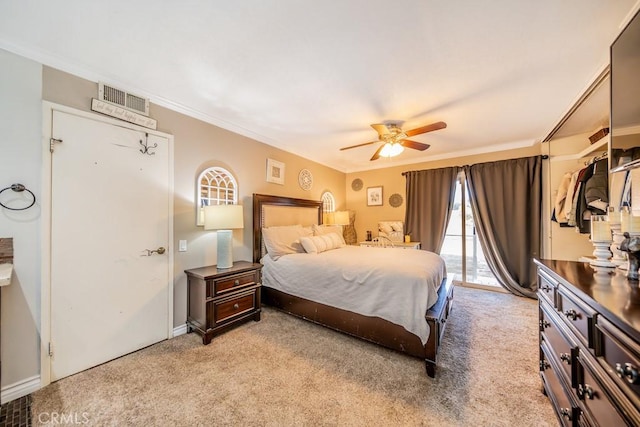 carpeted bedroom featuring access to outside, ceiling fan, and crown molding