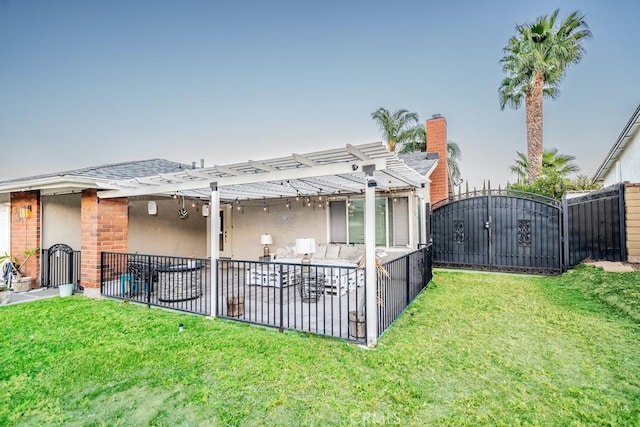 rear view of property with a pergola, a yard, and an outdoor hangout area