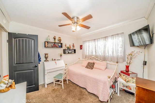 carpeted bedroom with ceiling fan and crown molding