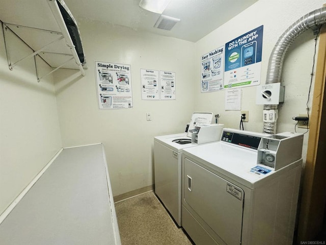 laundry area with washing machine and dryer