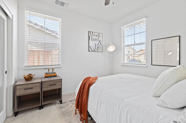 carpeted bedroom featuring ceiling fan