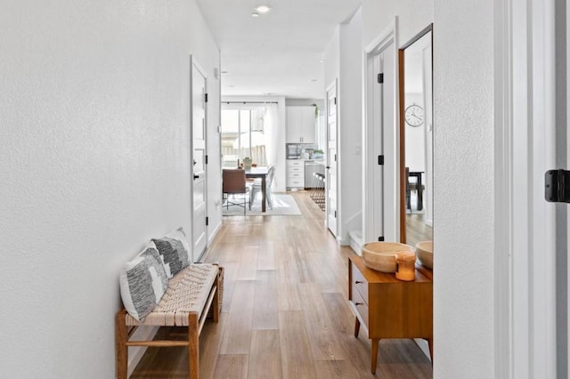 hallway featuring light hardwood / wood-style flooring